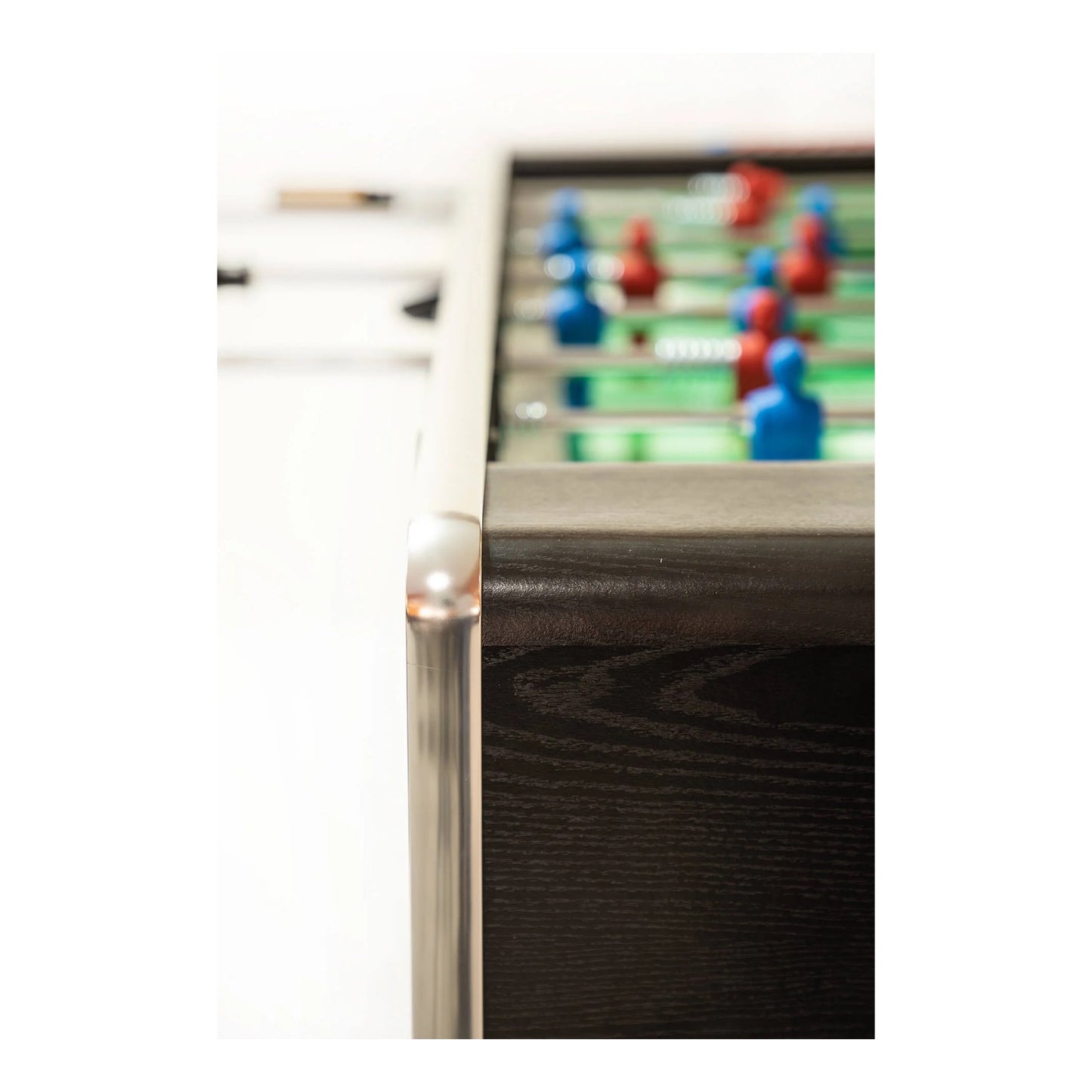 Close-up of a foosball table with players on the table