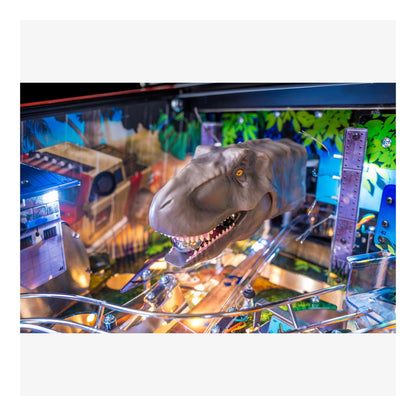 Dinosaur figure on a pinball machine with colorful background