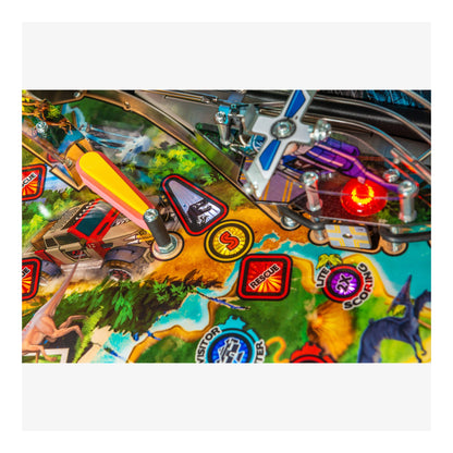 Close-up of a pinball machine with colorful playfield and various symbols.