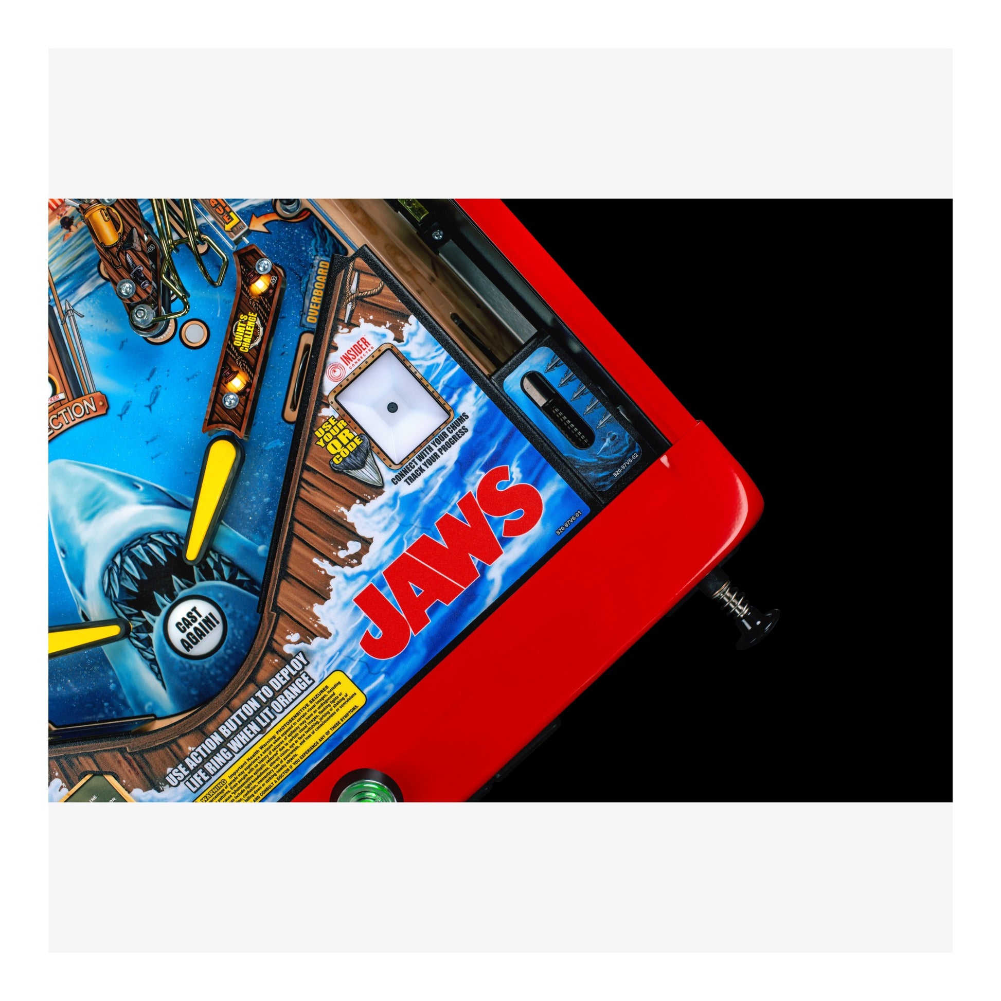 Pinball machine with 'Jaws' branding on a white background