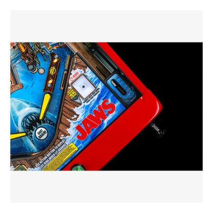 Pinball machine with 'Jaws' branding on a white background