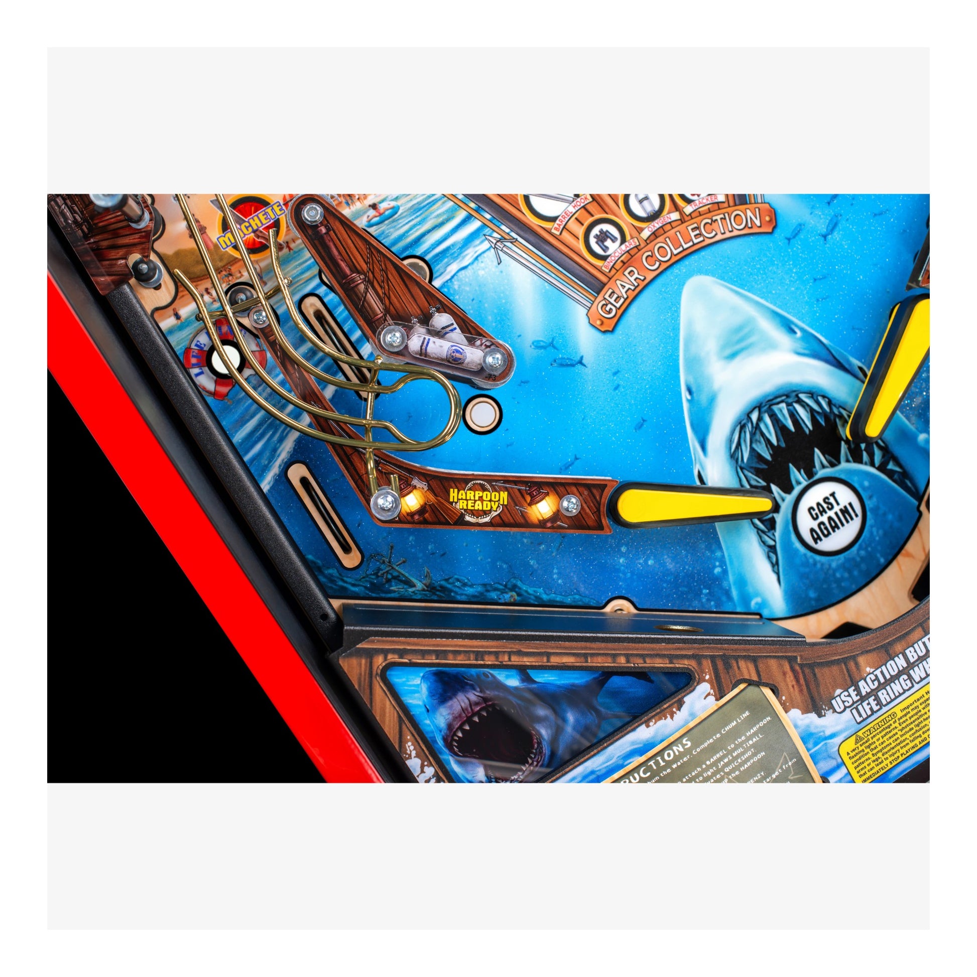 Close-up of a pinball machine with a shark design and 'Gast Miami' label.