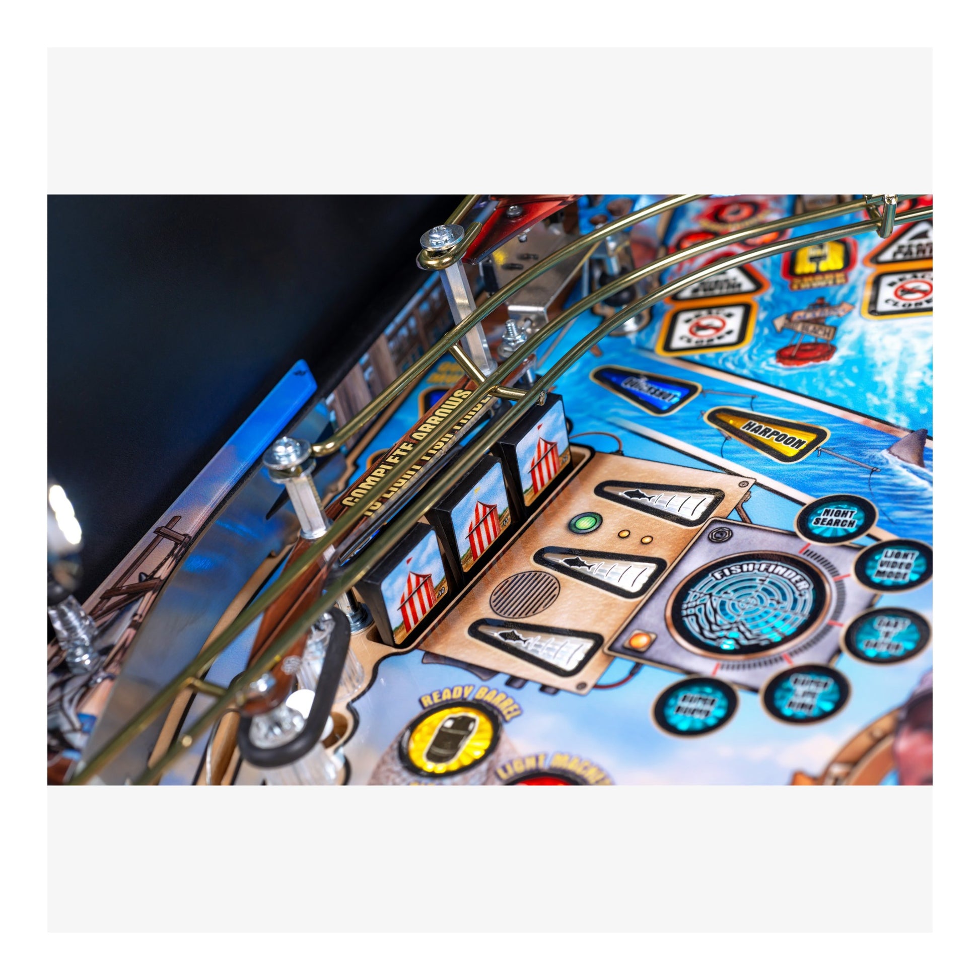 Close-up of a pinball machine with detailed artwork and playfield.