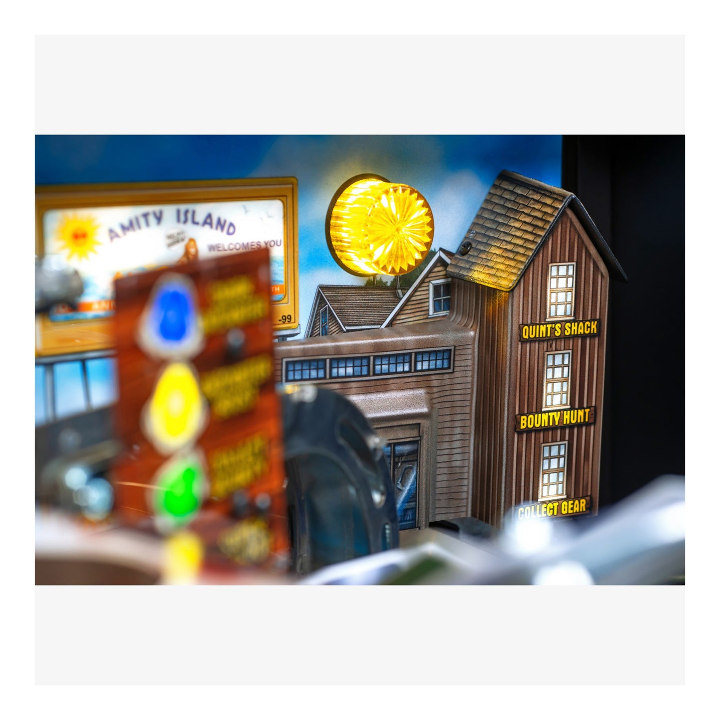 Toy set with a building labeled 'Quint's Shack' and a traffic light, resembling a scene from a movie or TV show.