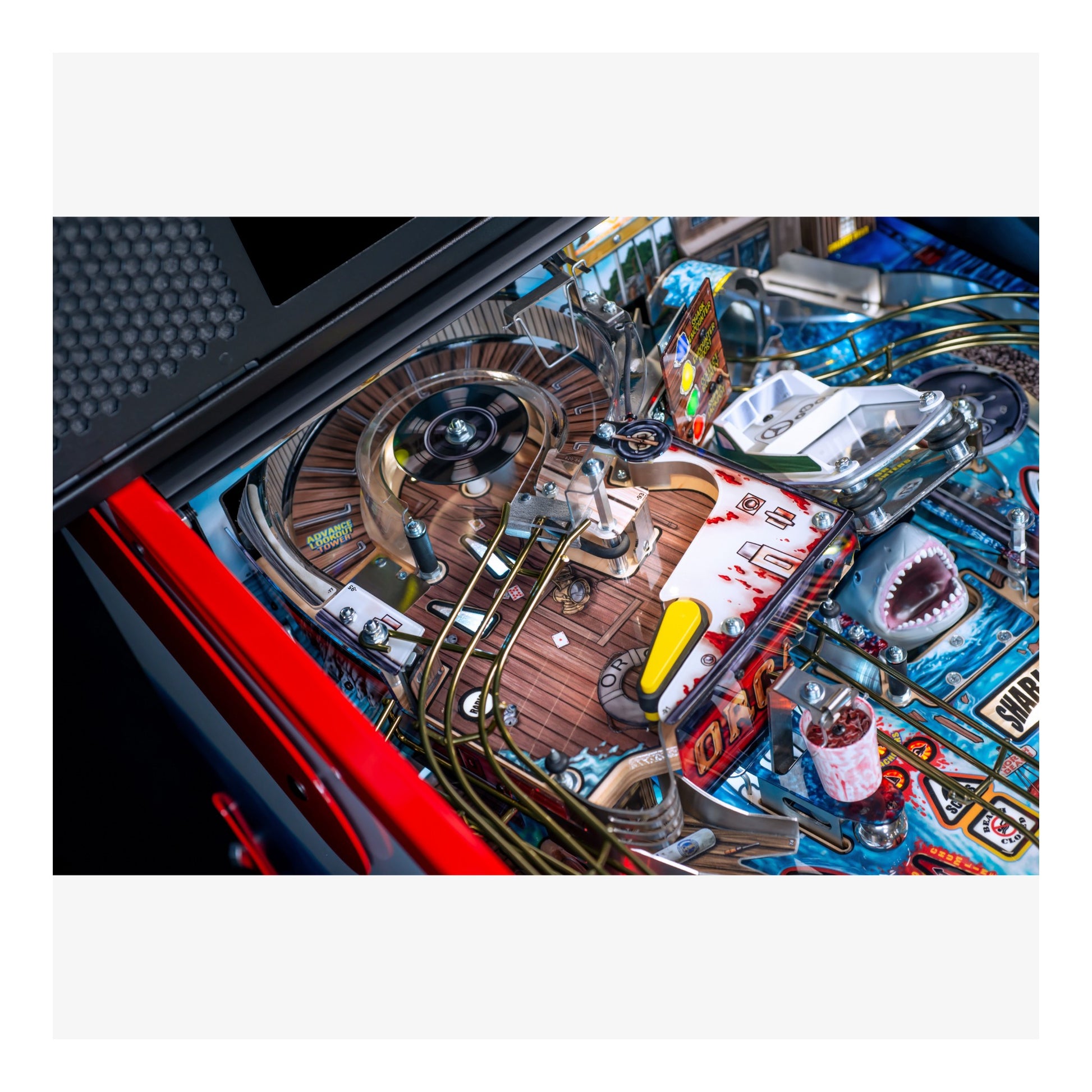 Close-up of a pinball machine with detailed components