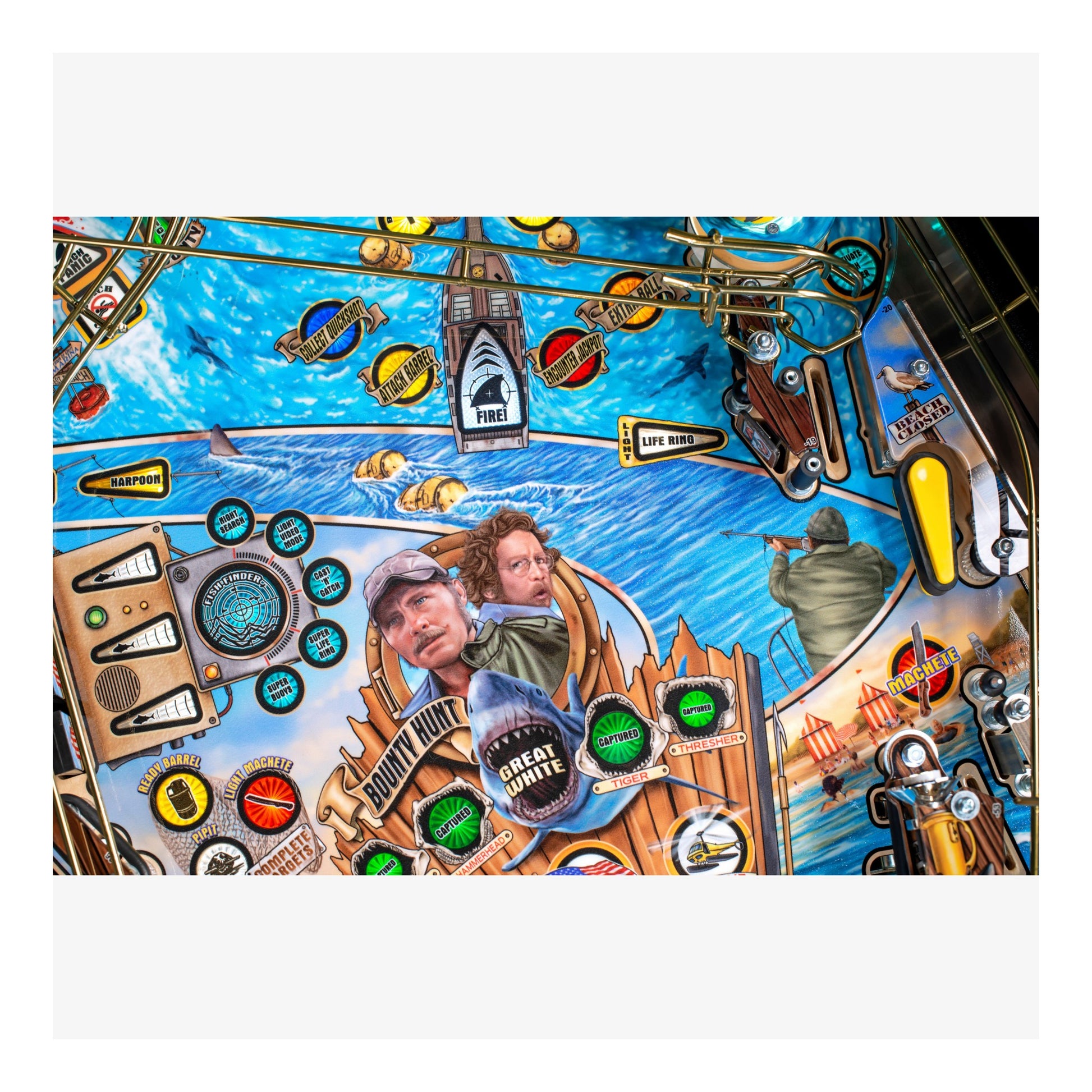 Colorful pinball machine with various symbols and a central portrait.