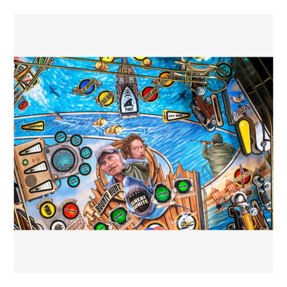 Colorful pinball machine with various symbols and a central portrait.