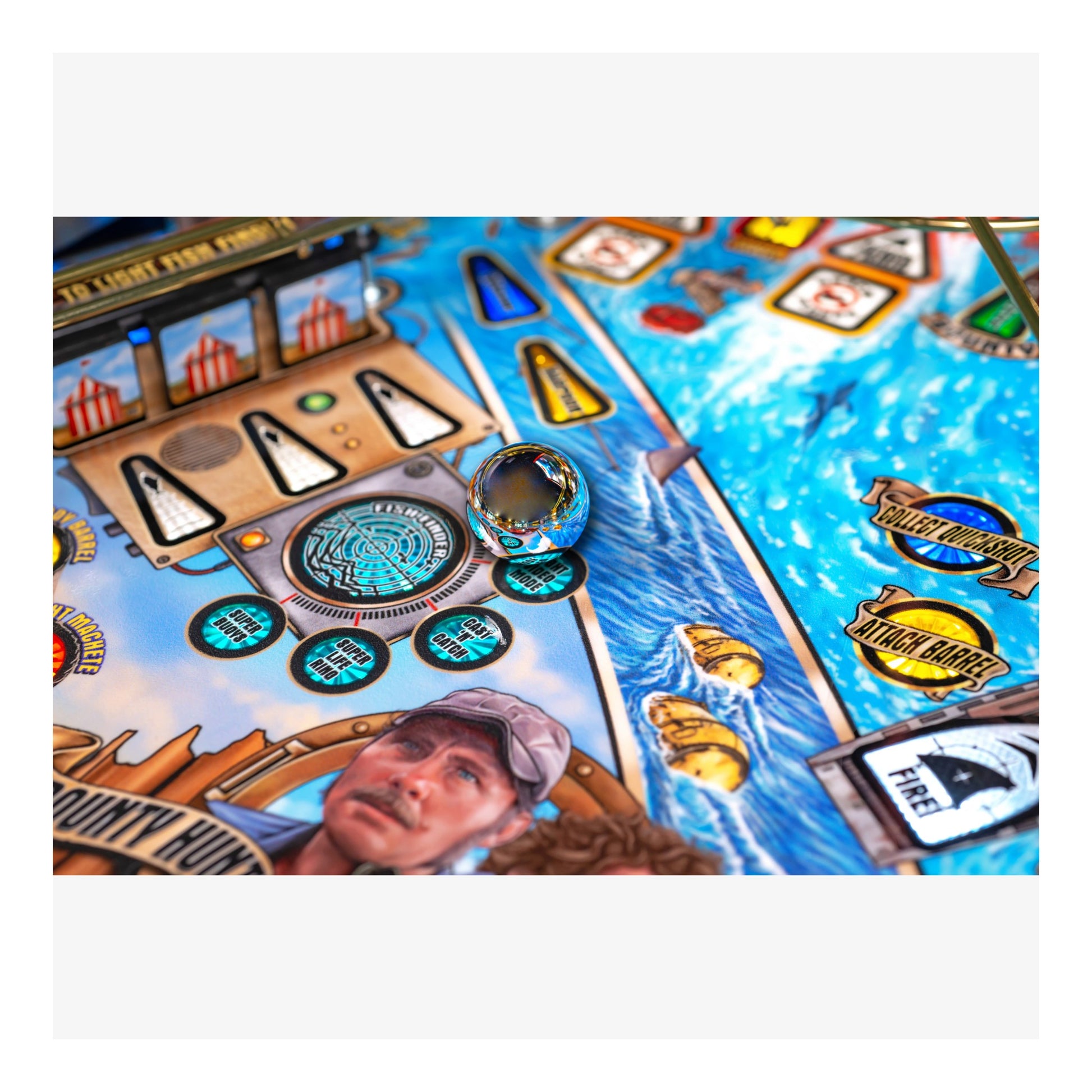 Close-up of a pinball machine with detailed artwork and player image.