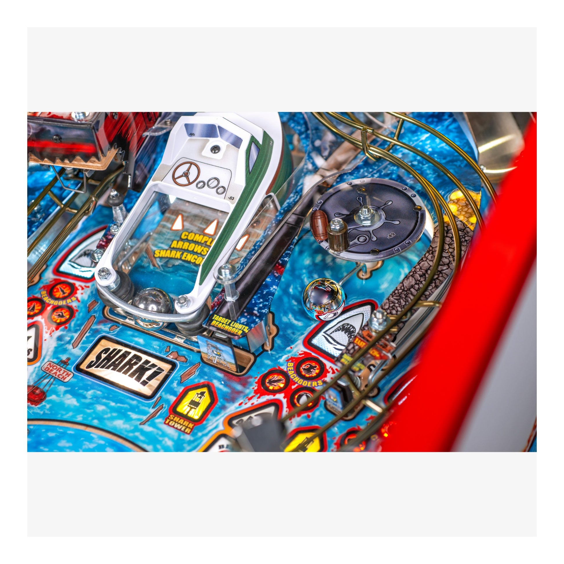 Close-up of a pinball machine with detailed artwork and playfield.