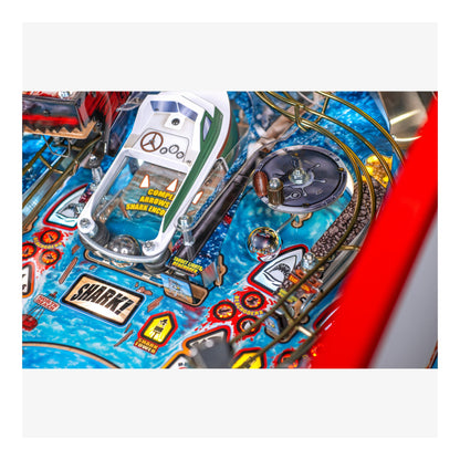 Close-up of a pinball machine with detailed artwork and playfield.