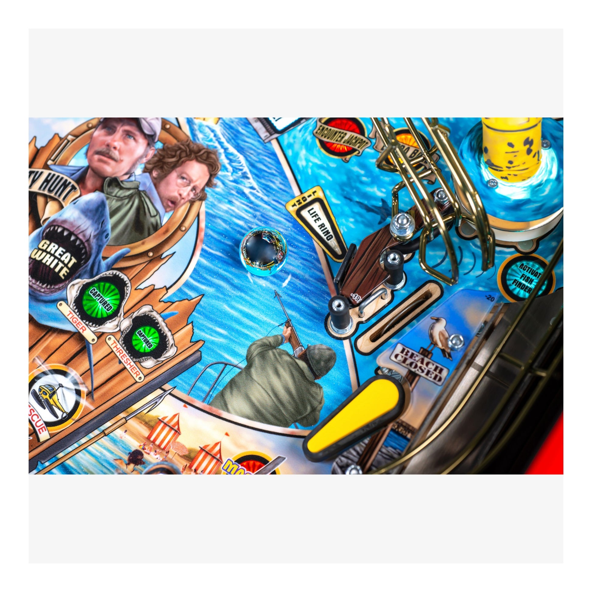 Close-up of a pinball machine with detailed artwork and elements.