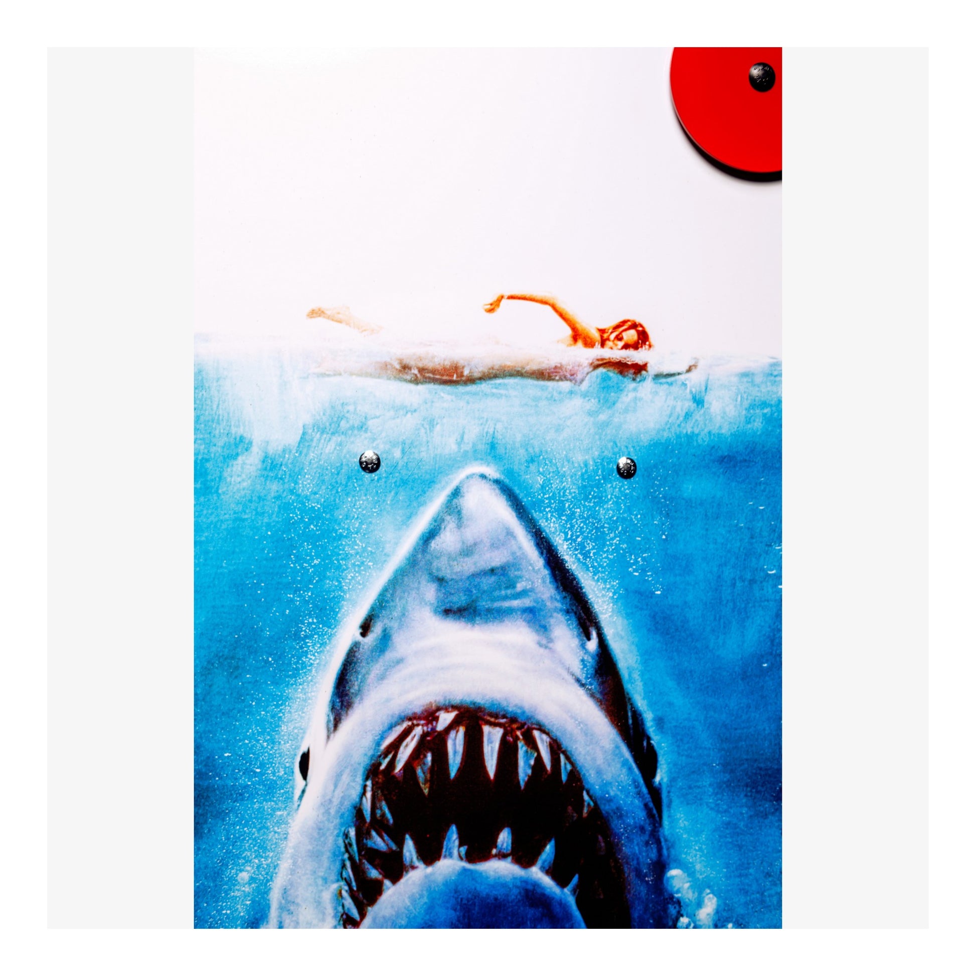 Illustration of a shark emerging from water with people in the background