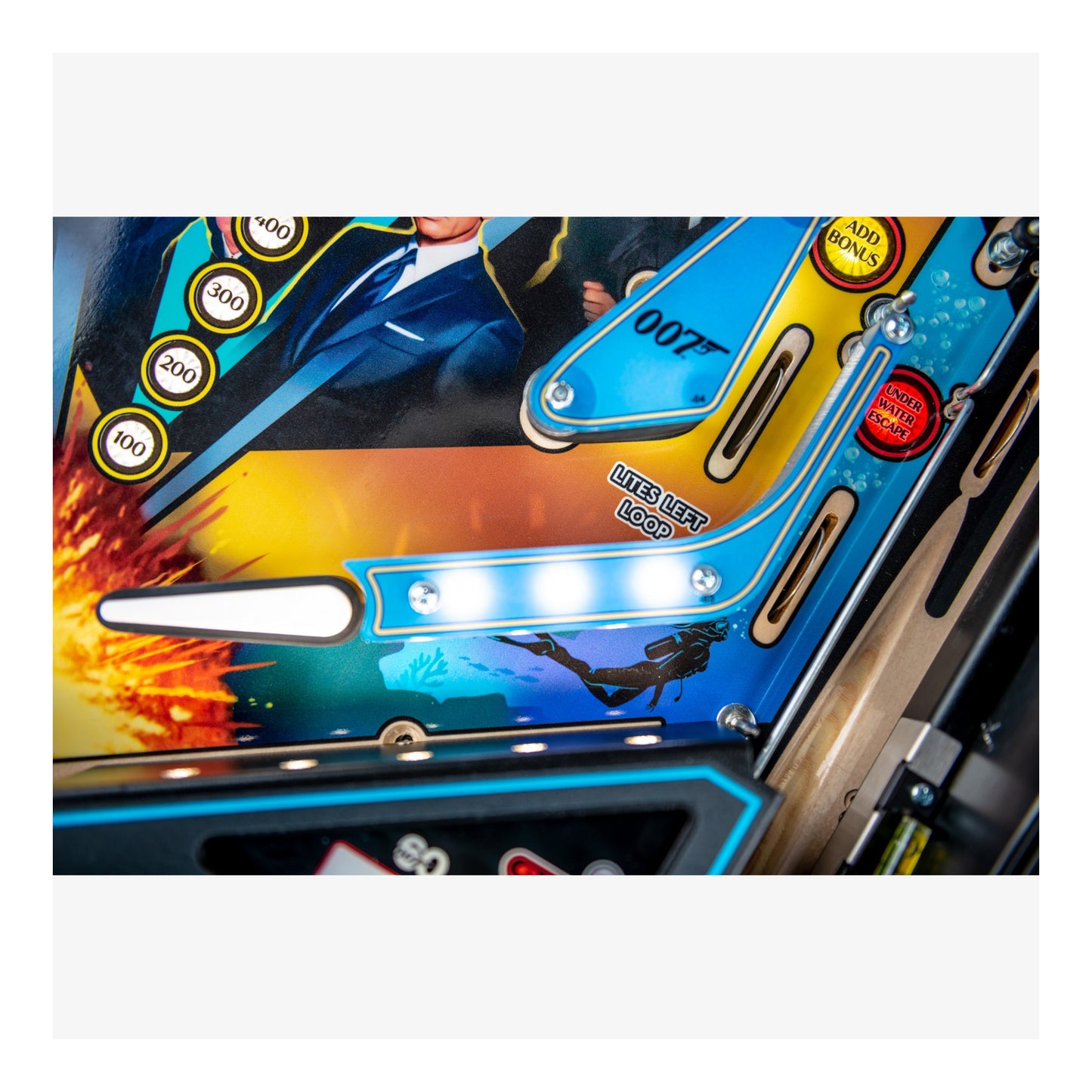 Close-up of a colorful pinball machine with vibrant graphics and text.