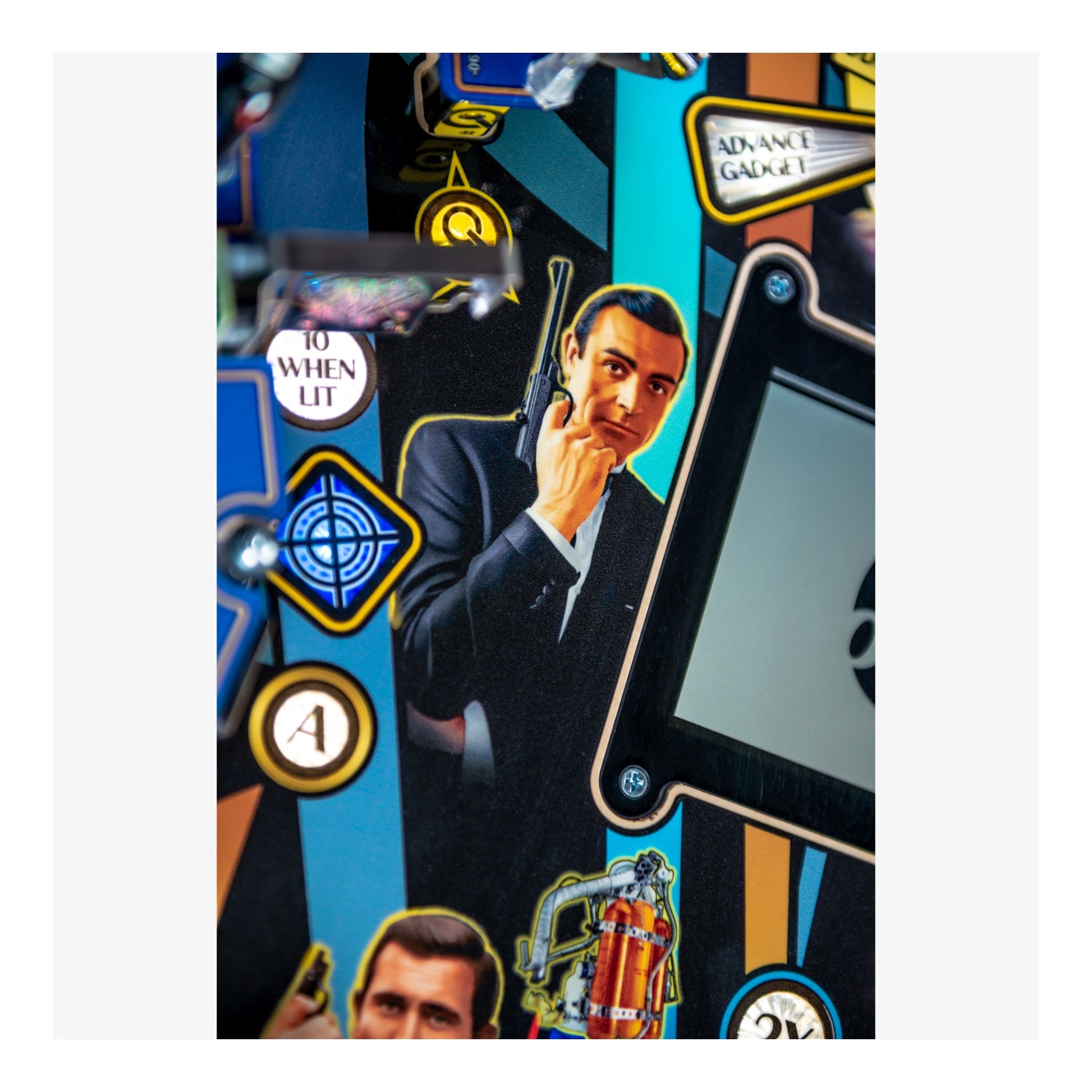 Pinball machine with James Bond theme featuring a character in a suit and a gun.