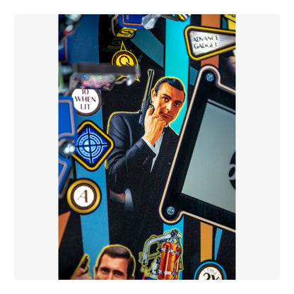 Pinball machine with James Bond theme featuring a character in a suit and a gun.
