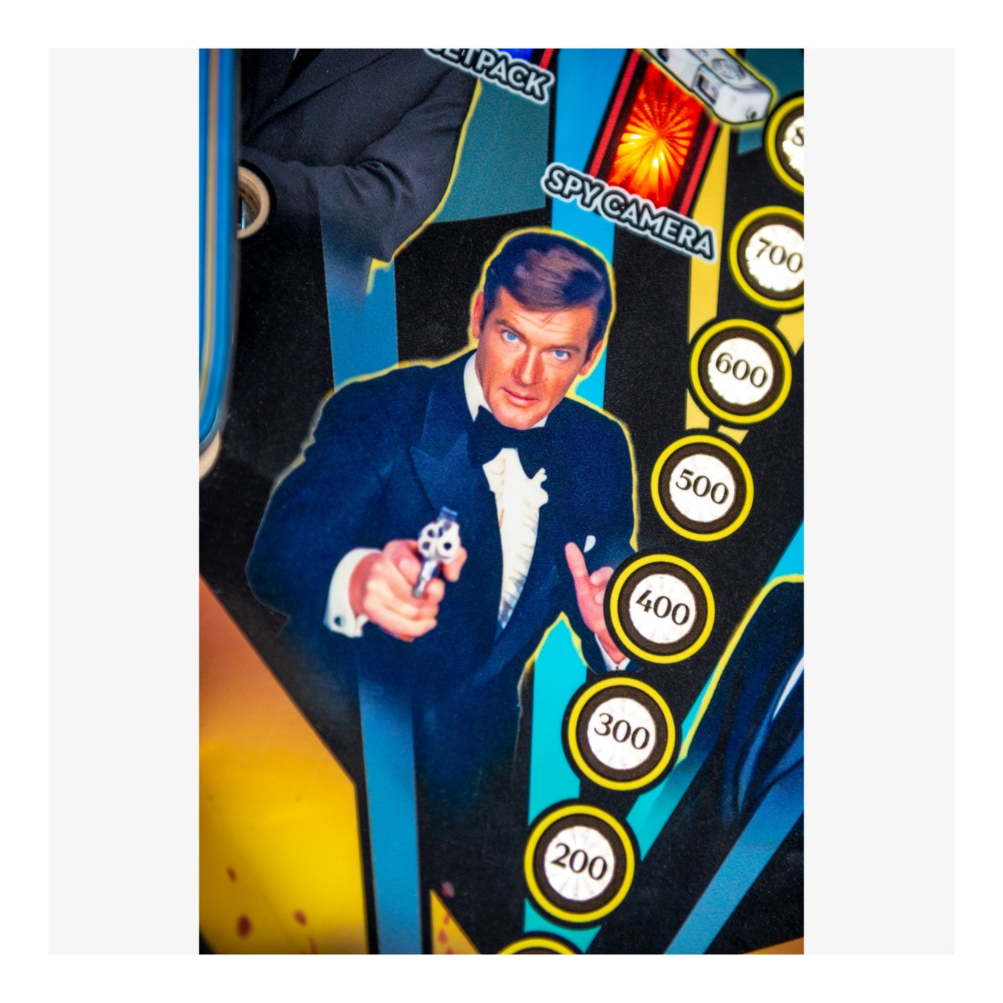 Card featuring a character in a tuxedo with spy-themed elements and numbers.