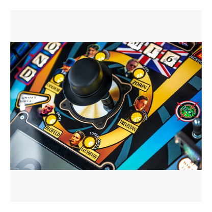 Close-up of a pinball machine joystick with colorful design and branding.
