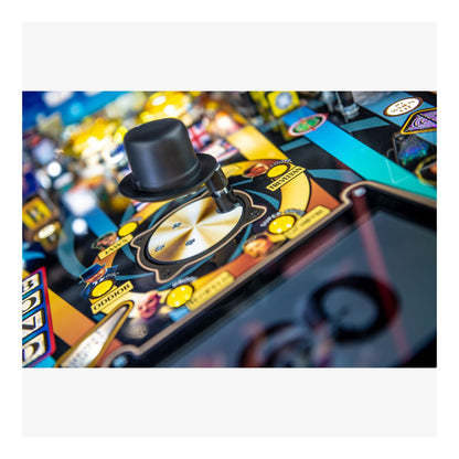 Close-up of a pinball machine with a top hat and colorful playfield.