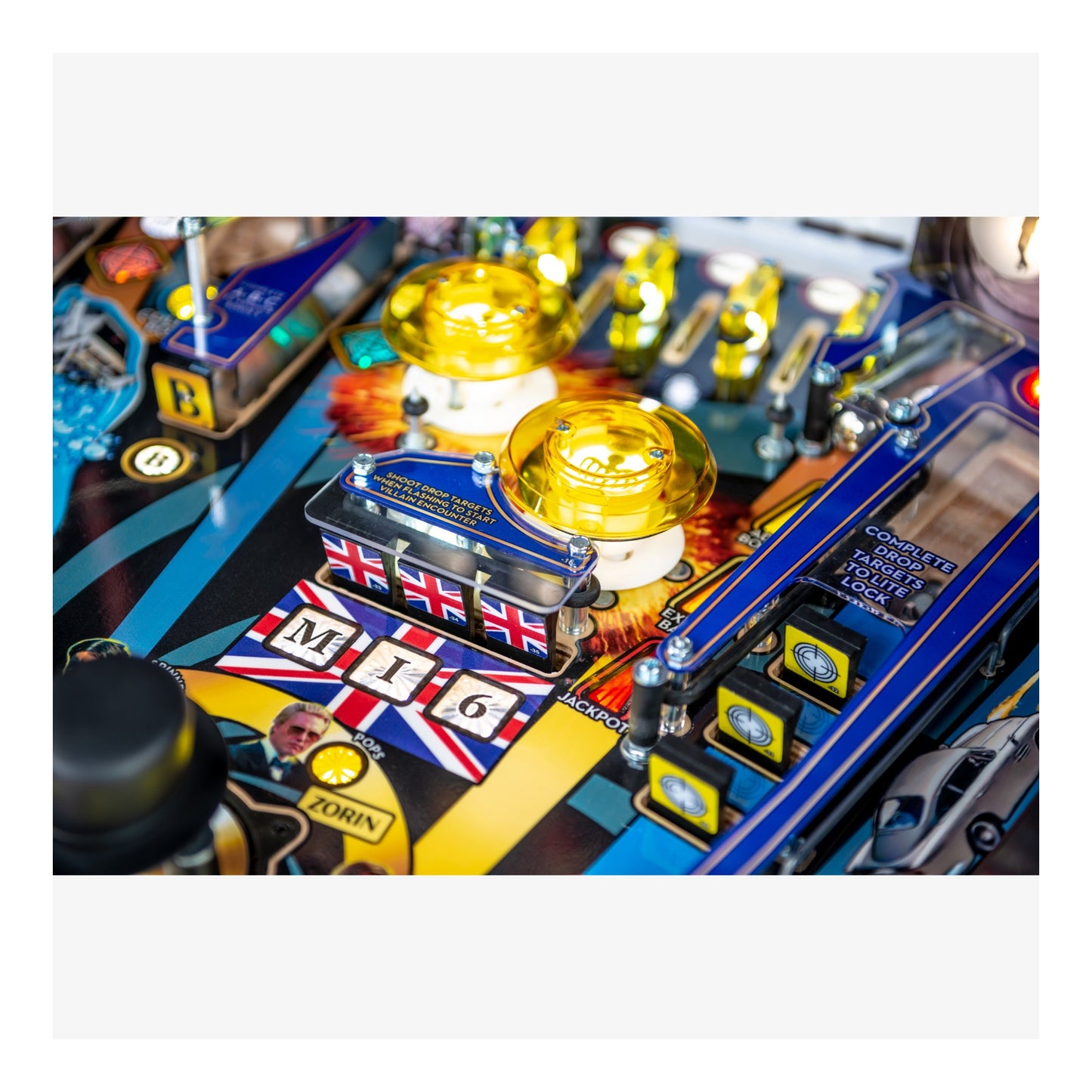 Close-up of a pinball machine with 'MI6' branding and British flag design.