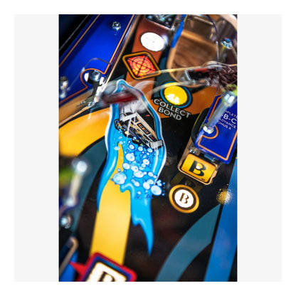 Close-up of a colorful pinball machine with 'Collect Bond' branding.