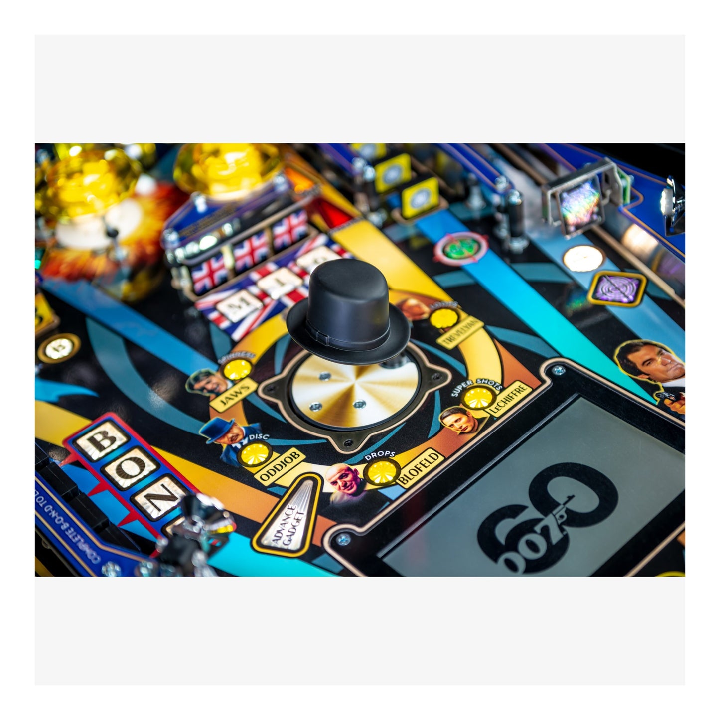 Close-up of a pinball machine with colorful design and '007' branding.