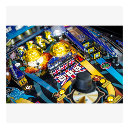 Close-up of a colorful pinball machine with various components and a British flag design.