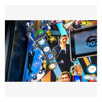 Close-up of a pinball machine with colorful artwork and characters.