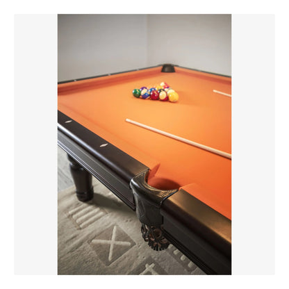 A close-up of the Aristocrat pool table's corner pocket and solid white birch rail, showcasing the wood grain.