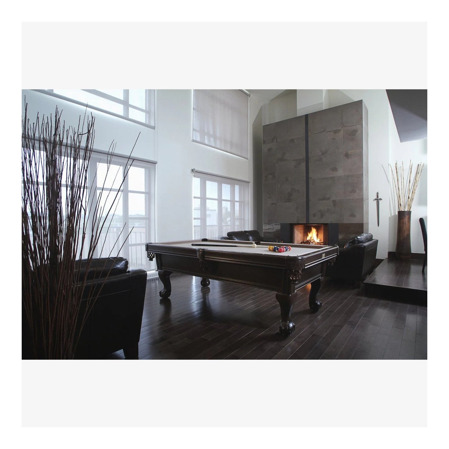 A side profile of the Banff pool table, highlighting the solid white birch rails and intricate Ball & Claw legs.