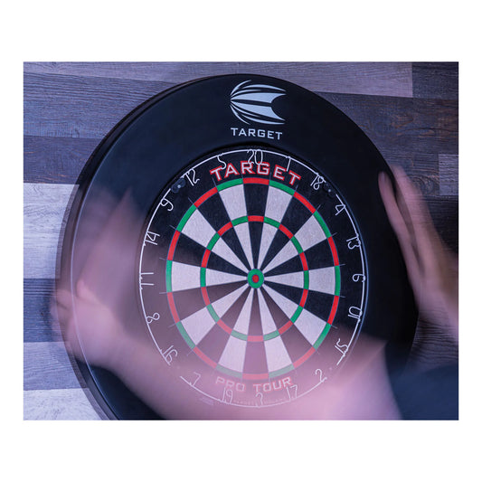 Dartboard with 'Target' branding on a wooden surface surrounded with black Pro Tour