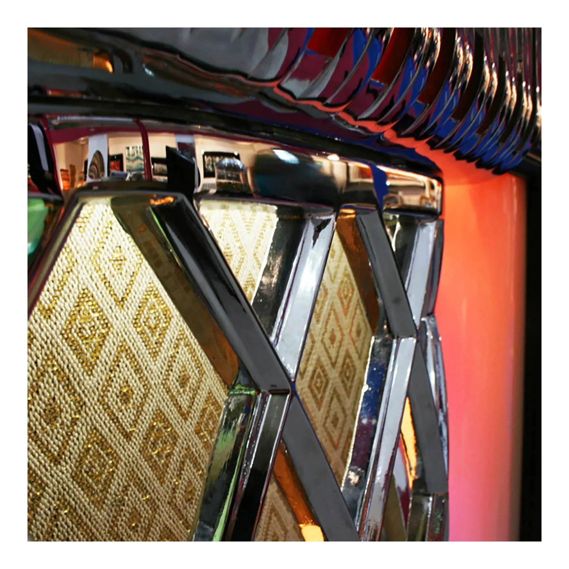 A view of the Gloss White Rock-Ola Bubbler from a low angle, emphasizing the speaker grille.