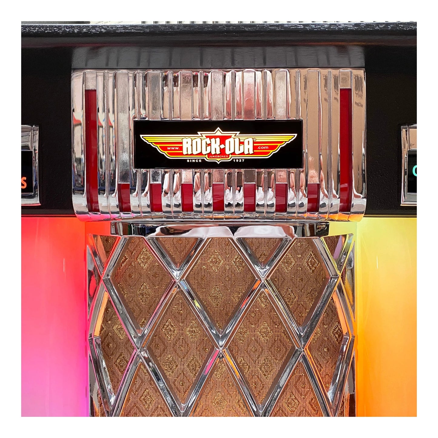 Metallic jukebox with 'Rock-Ola' logo on a colorful background
