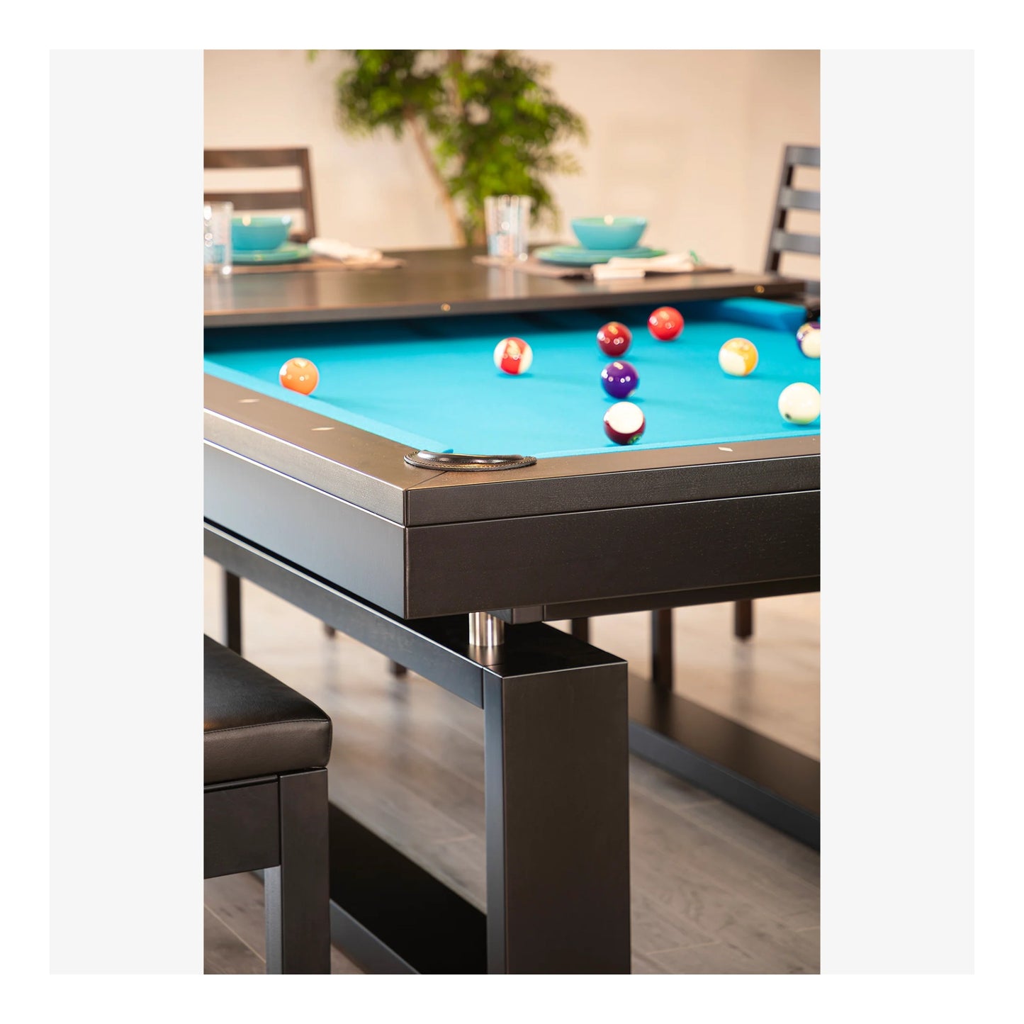 A side-angle shot of the Cloud pool table, focusing on the solid wood rails and the unique base structure that creates the floating illusion.