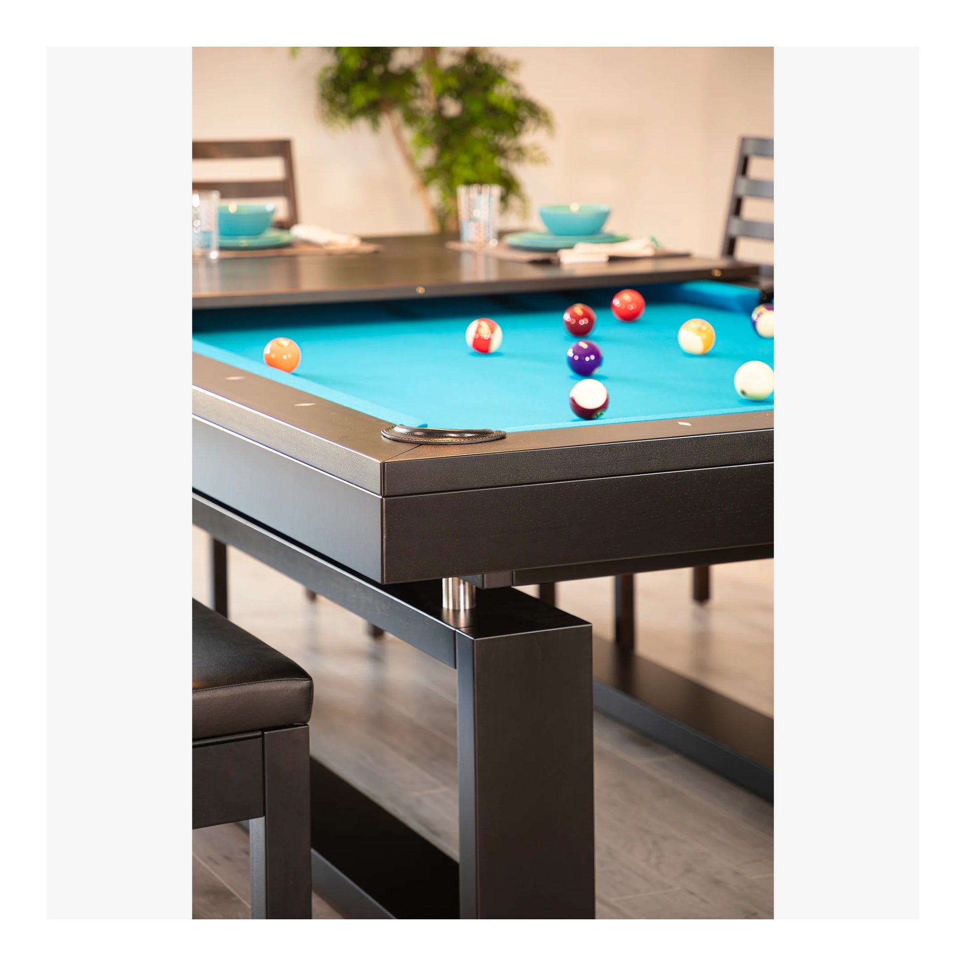 A side-angle shot of the Cloud pool table, focusing on the solid wood rails and the unique base structure that creates the floating illusion.