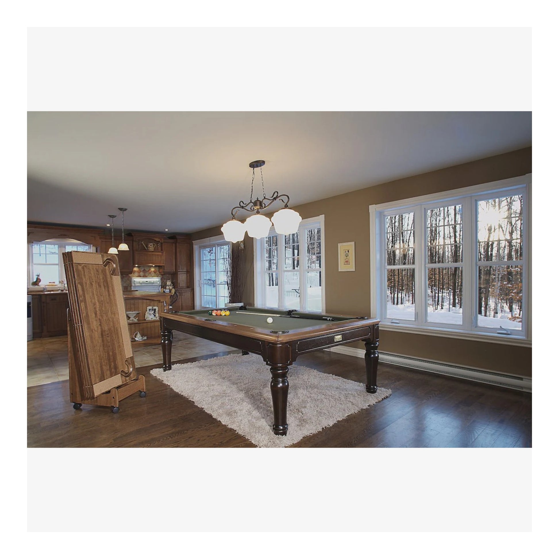 The Colonial pool table with the dining top removed, showing the slate playing surface and pockets.