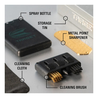 Collection of Target brand dart maintenance tools including a spray bottle, storage tin, metal point sharpener, cleaning cloth, and cleaning brush on a gray background.