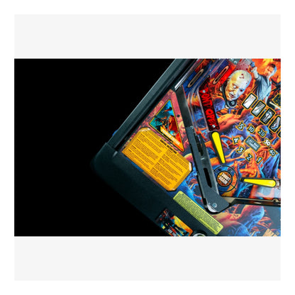 Premium Stern Pinball The Walking Dead.  Close-up of a colorful pinball machine with detailed artwork and text.