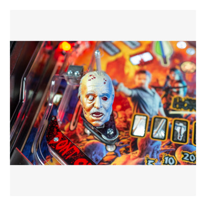Premium Stern Pinball The Walking Dead.  Close-up of a pinball machine with a character and score display