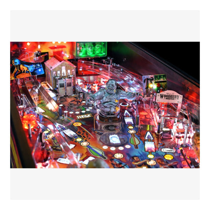 Premium Stern Pinball The Walking Dead.  Pinball machine with colorful lights and various game components on a white background