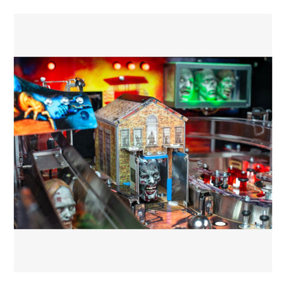Premium Stern Pinball The Walking Dead.  Pinball machine with a haunted house theme and ghostly figures.