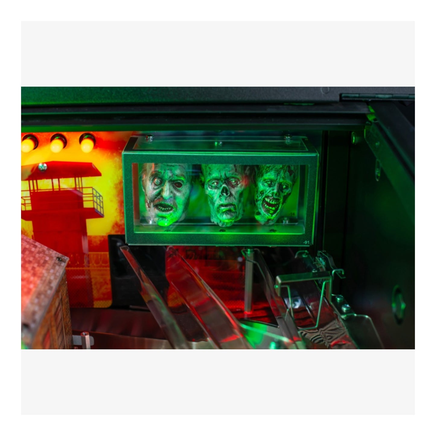 Premium Stern Pinball. Pinball machine with green glowing faces and colorful background