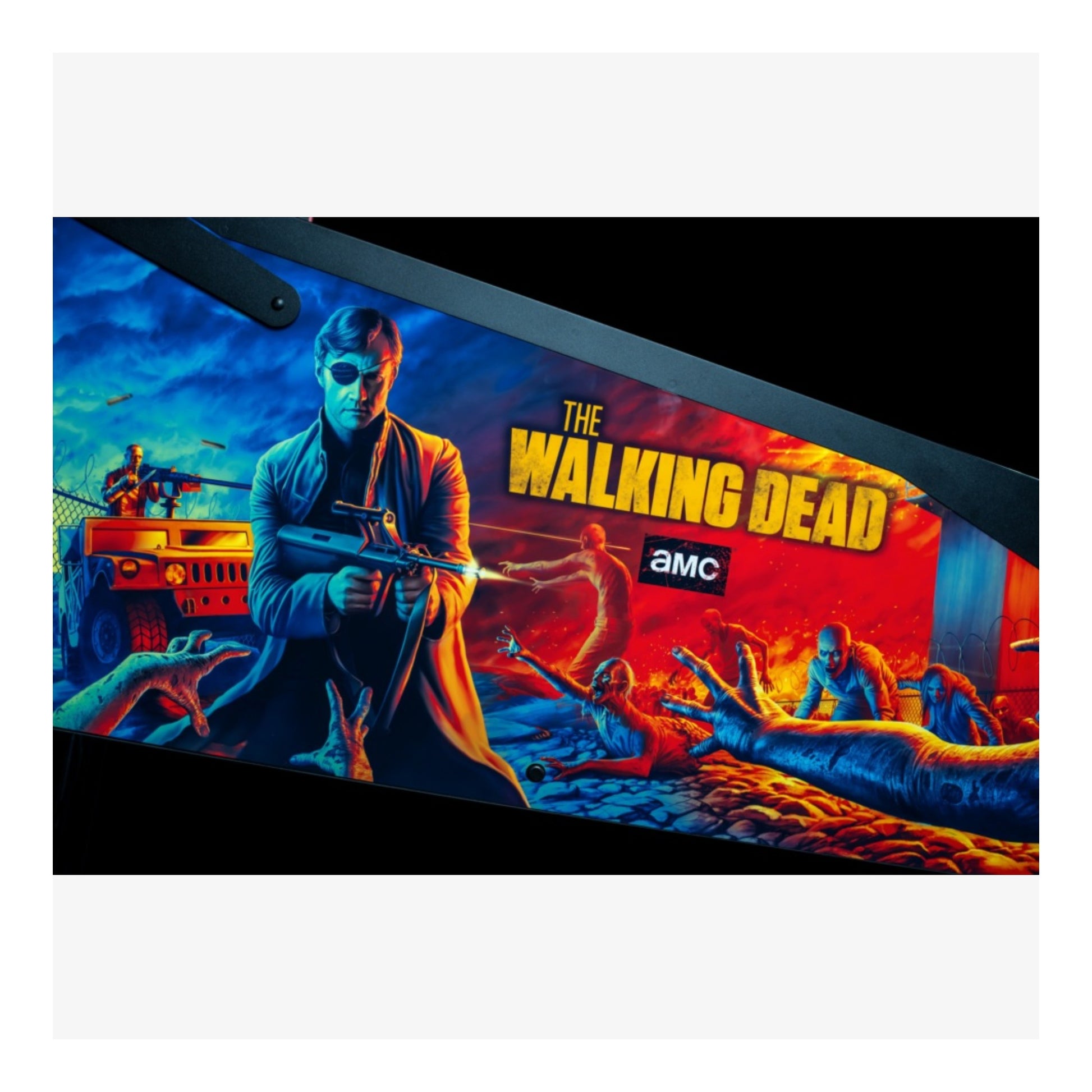 Premium Stern Pinball. Promotional graphic for 'The Walking Dead' with a character holding a gun and zombies in the background, featuring the AMC logo.