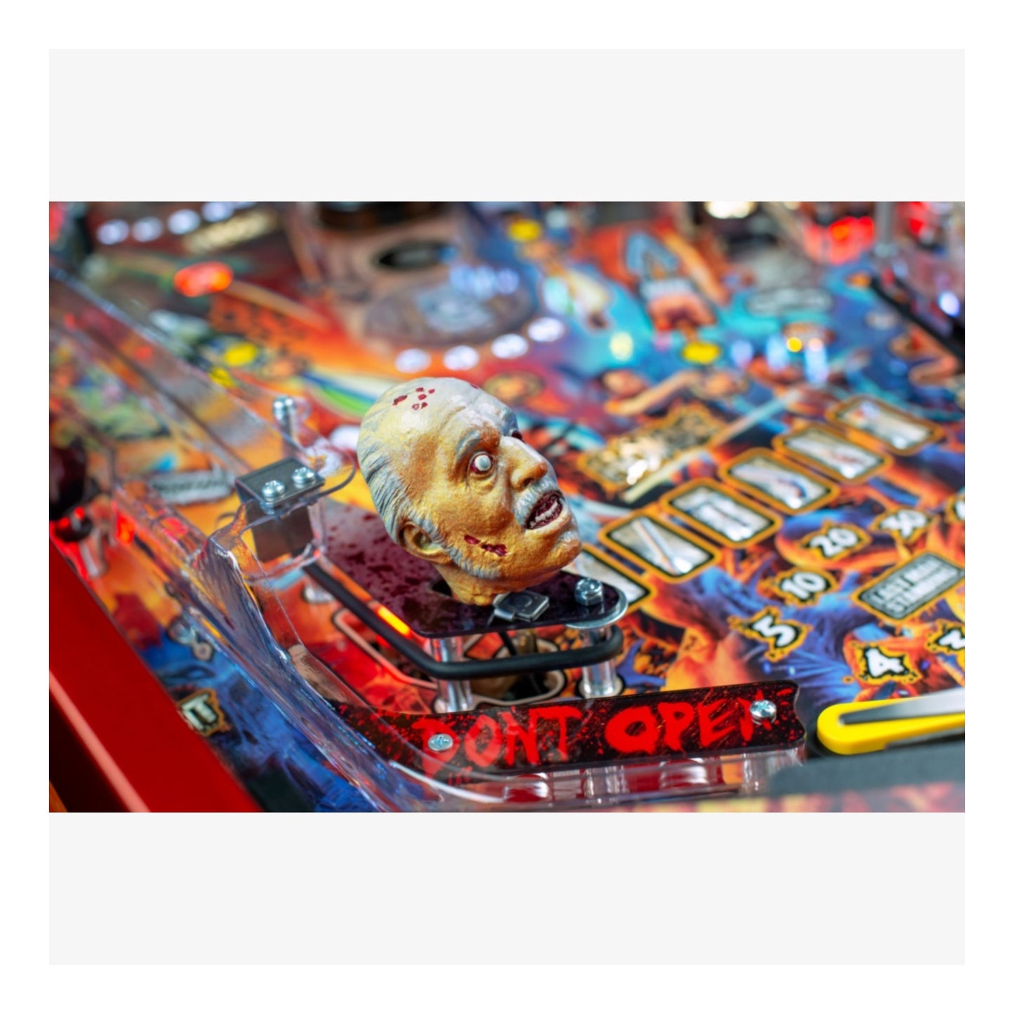 Limited Edition Stern Pinball. Close-up of a pinball machine with a zombie figure and 'Don't Open' text.