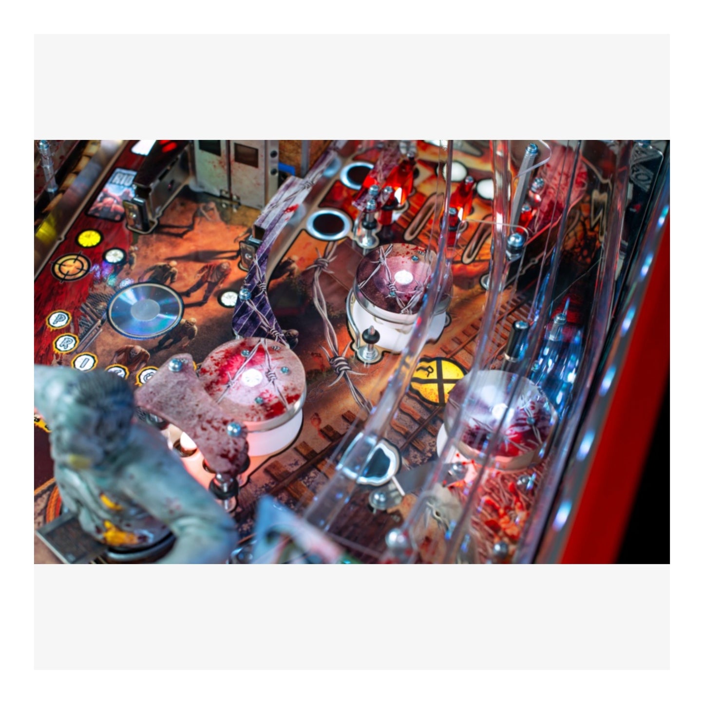 Limited Edition Stern Pinball. Close-up of a pinball machine with glowing lights and mechanical components.