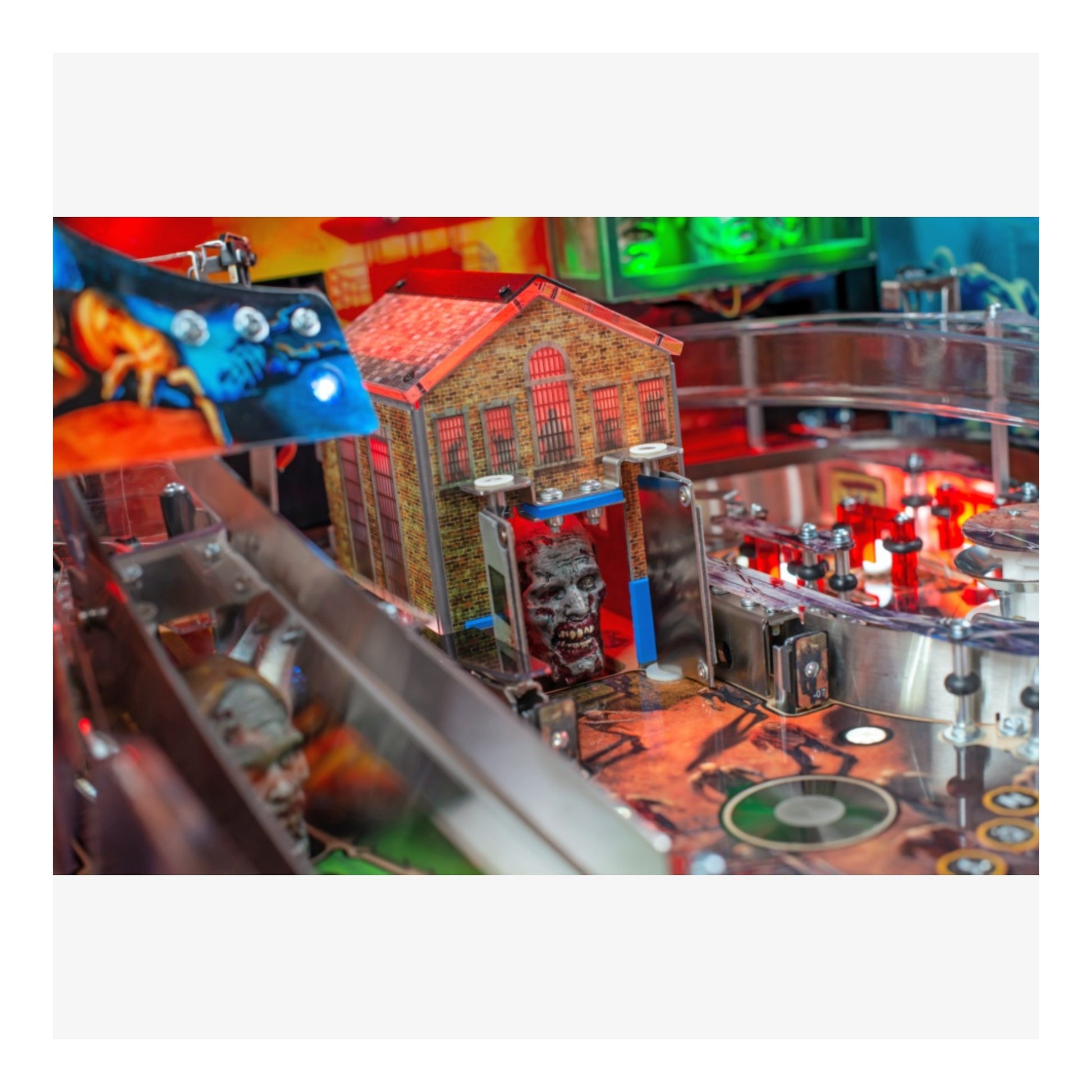 Limited Edition Stern Pinball. Close-up of a pinball machine with colorful lights and mechanical components.