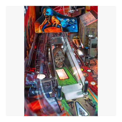 Limited Edition Stern Pinball. Close-up of a pinball machine with detailed artwork and mechanical components.