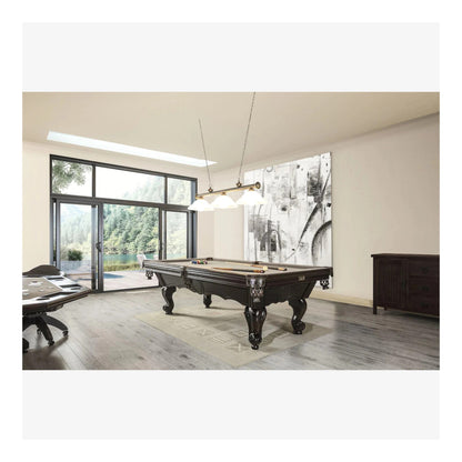 Modern room with a pool table and large windows