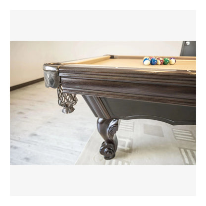 Pool table with billiard balls on a light-colored floor