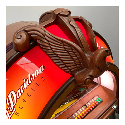 Close-up of a Davidson bicycle with wooden emblem on a gray background