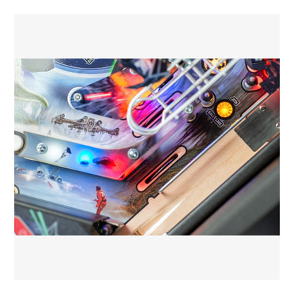 Premium Stern Pinball Close-up of a colorful pinball machine with detailed artwork and lights.